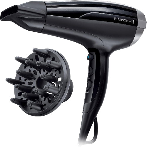 Black hair dryer with detachable nozzle attachment on a white background, featuring the Remington brand.