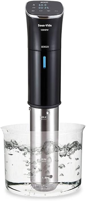 Sous-vide cooker with digital display and control panel, placed in a clear container of water.