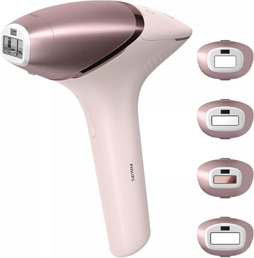 Philips hair removal device with multiple attachments on a white background